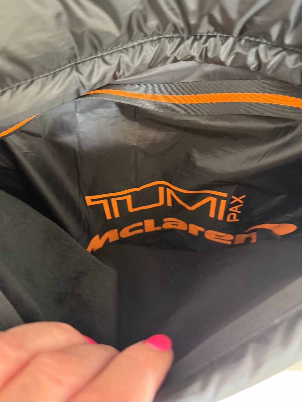 TumiPAX McLaren Packable Black Puffer Vest/Pillow with Orange Trim - Picture 11 of 12
